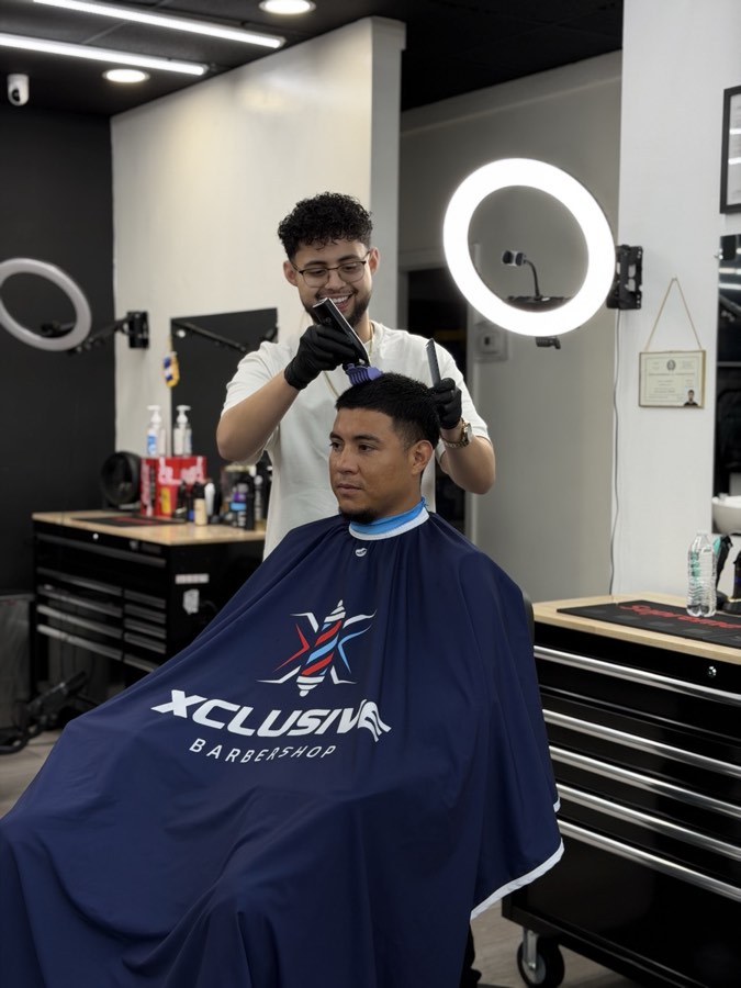 Barber working on a fade